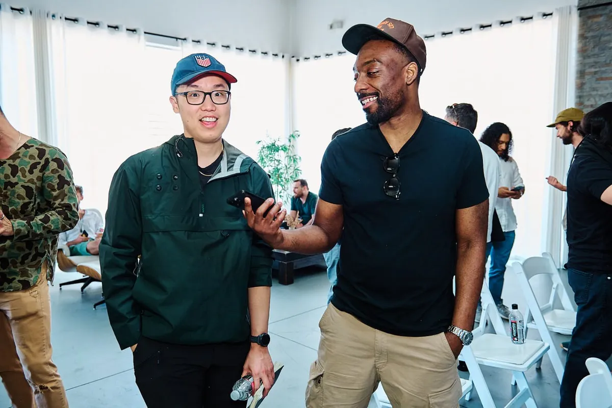 Attendees relaxing and chatting at the venue before sessions