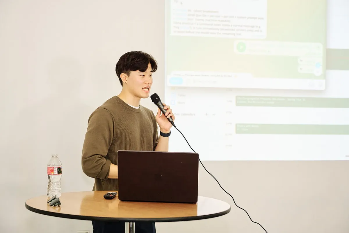 Presenter speaking before the Dennis shoutout